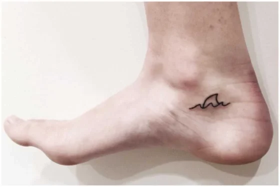 Minimalist Shark Fin Tattoo