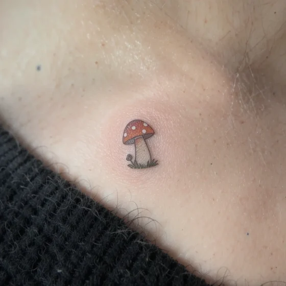 Tiny Toadstool Tattoo on the Collarbone