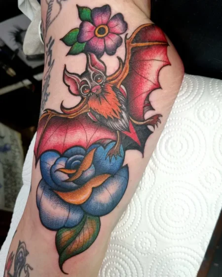Traditional Bat and Floral Tattoo