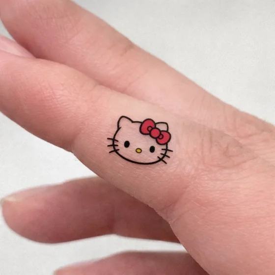 Tiny Hello Kitty Finger Tattoo