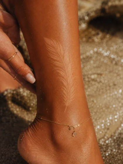 Feather Tan Tattoo