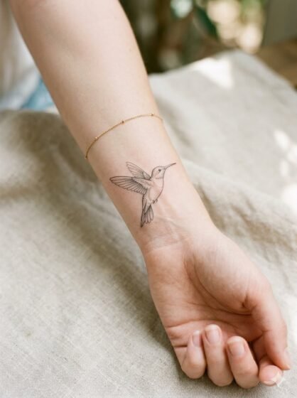 Fine Line Flying Hummingbird Tattoo