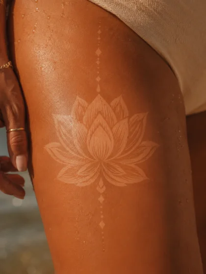 Lotus Flower Tan Tattoo