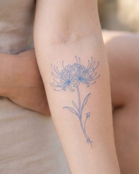 Minimal Blue Spider Lily Line Tattoo