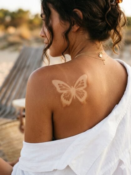 Tan Ink Butterfly Tattoo