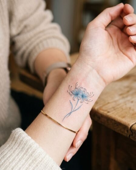 Tiny Blue Spider Lily Wrist Tattoo