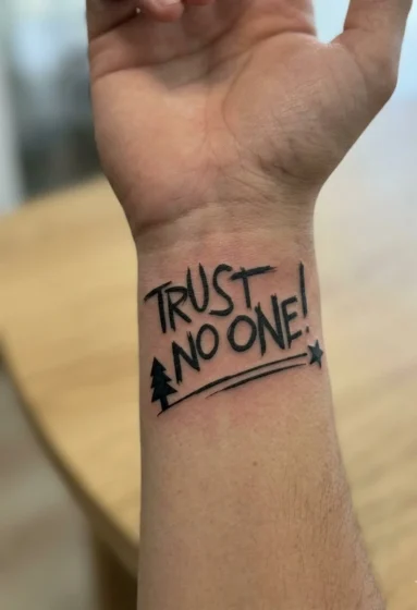 Trust No One" Quote Tattoo