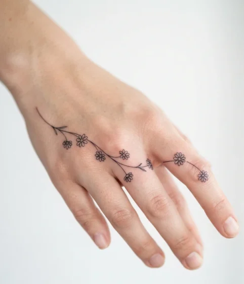 A Tiny Daisy Chain Along the Fingers